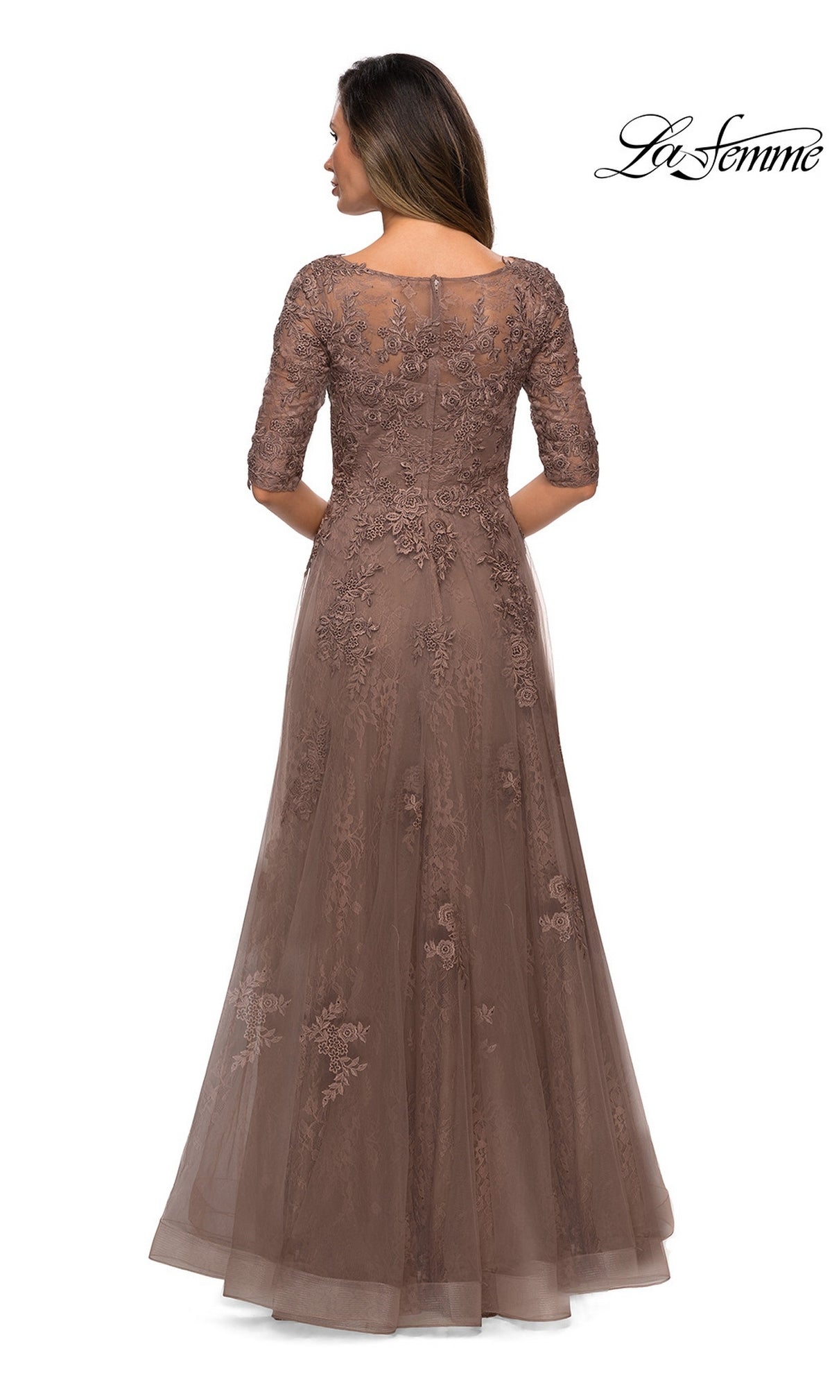 Woman in a brown floral lace applique Long Formal Dress: La Femme 28036 with three-quarter sleeves, shown from the back on a white background; “La Femme” logo top right.